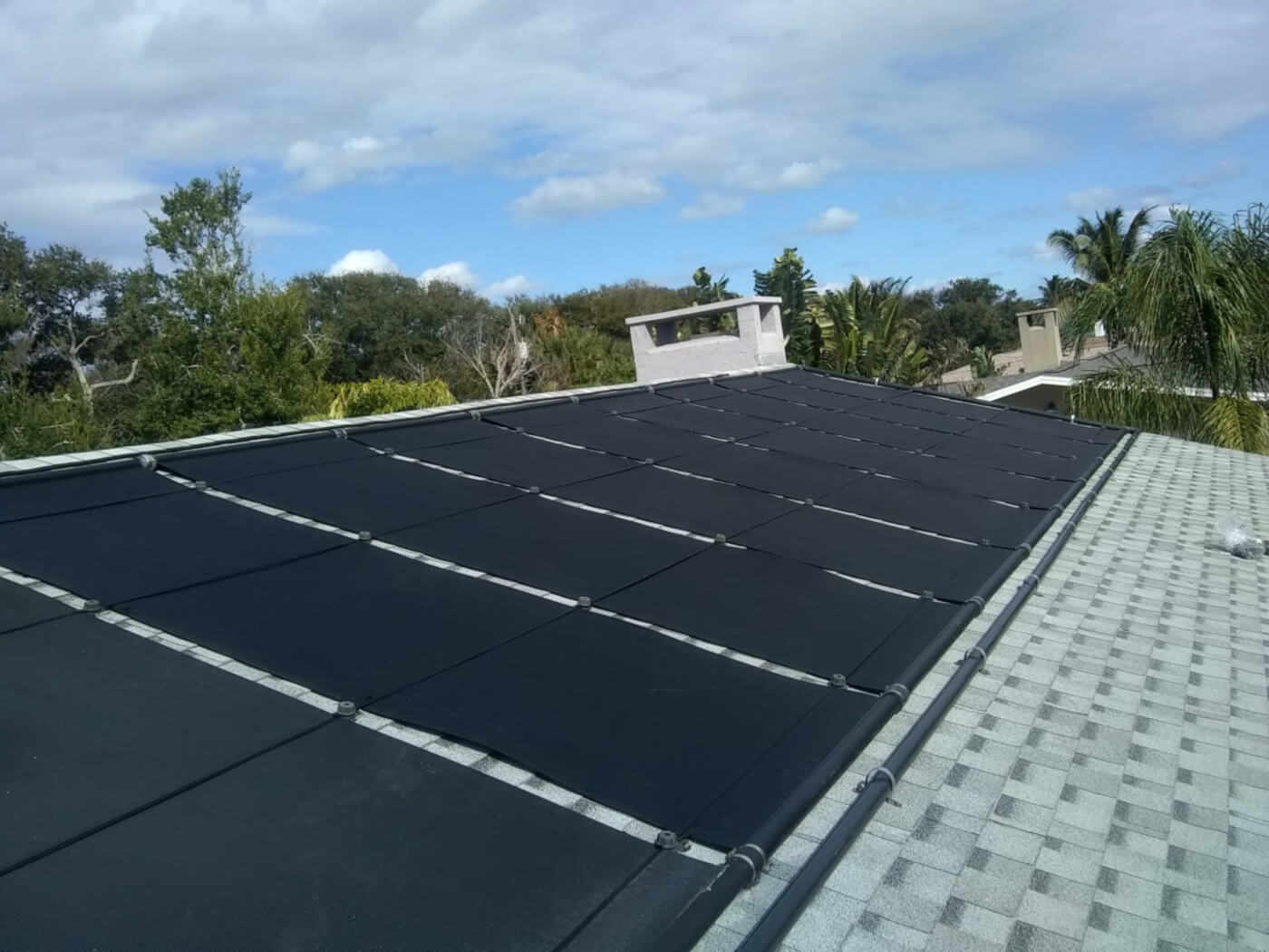 Sunsplash solar pool heating panel on roof