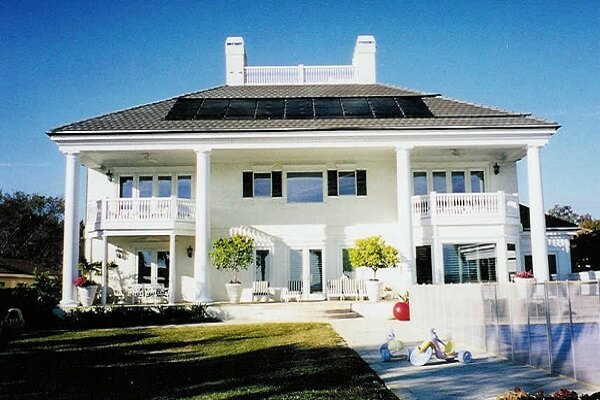 solar pool heating panels on roof of house